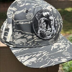 Akoo Gray and Cream Panther Trucker hat